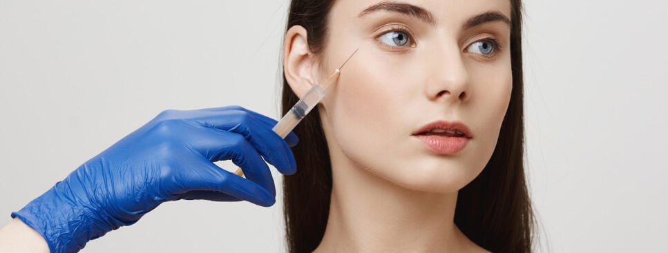 woman-beauty-salon-look-away-receive-bottox-face-injection-with-syringe 1