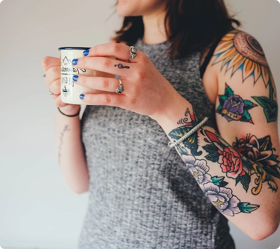 Tattooed-woman-enjoying-a-cup-of-coffee-img